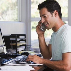 Man on phone in home office